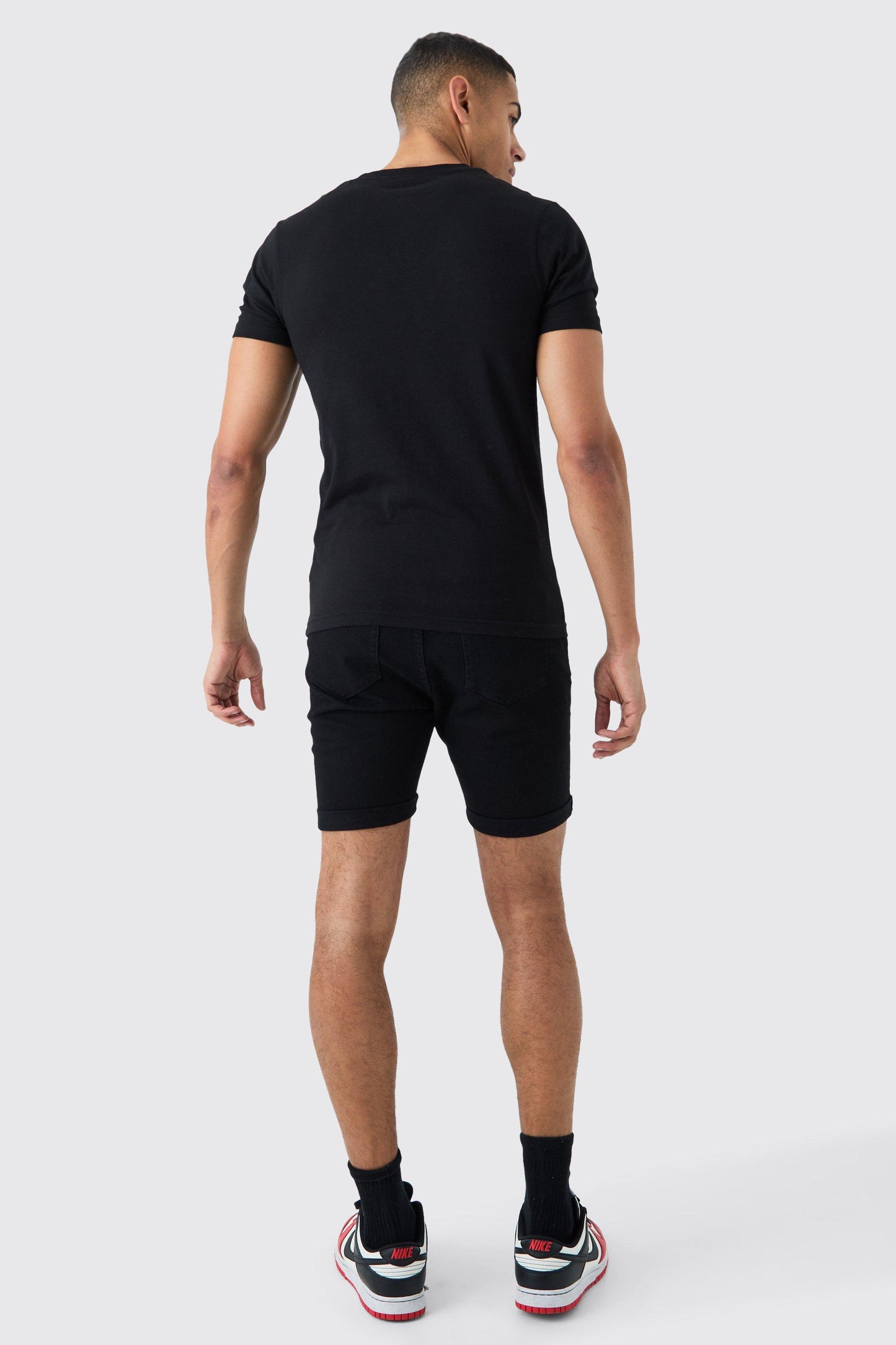 SKINNY STRETCH DENIM SHORTS IN BLACK