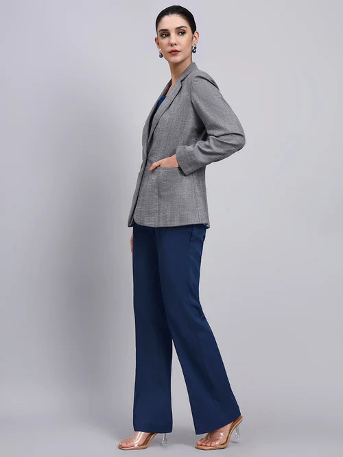 Side view women grey blazer suit with navy blue pants stylish formal wear