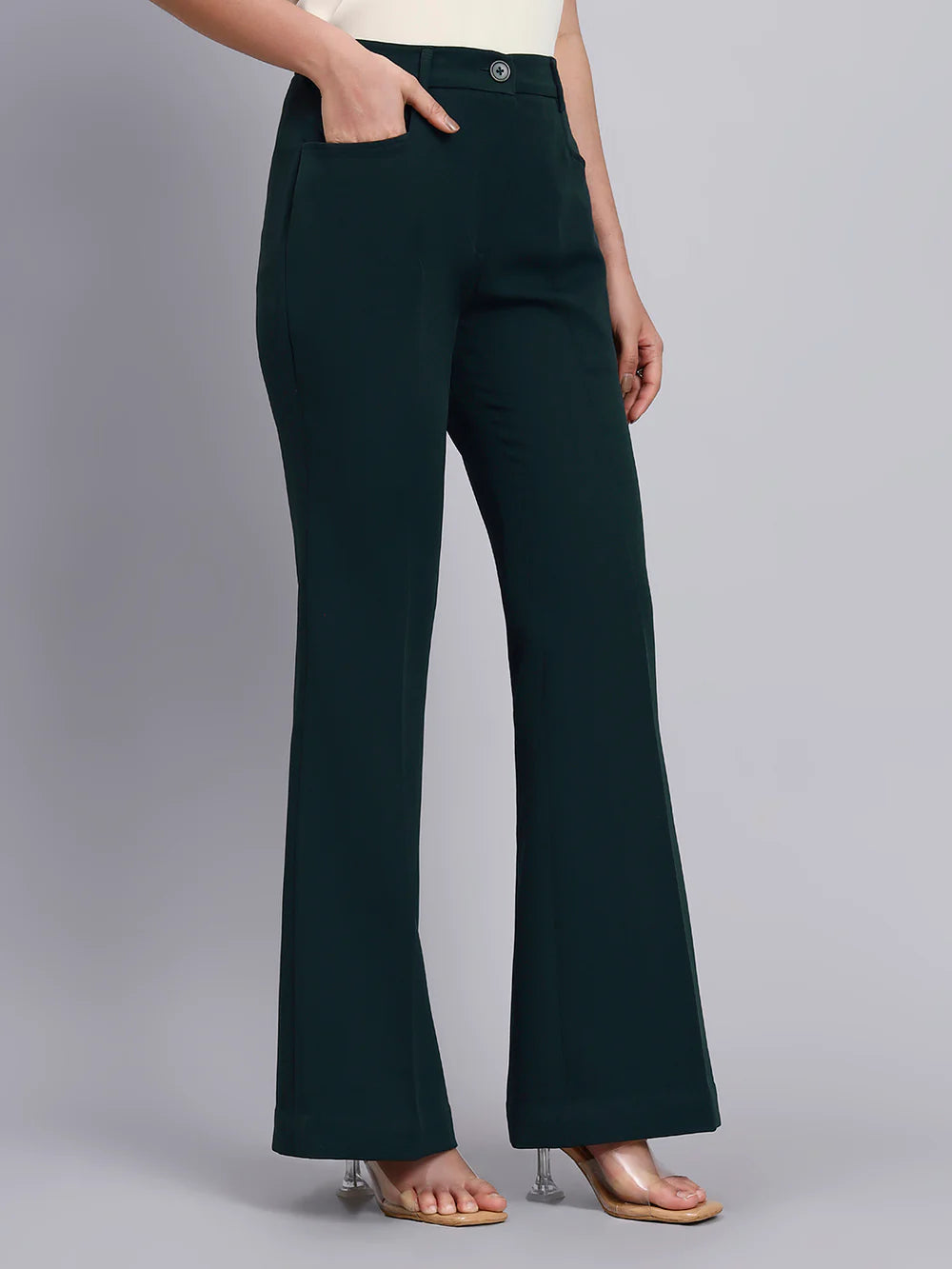 Dark green pants worn by a person on a gray background